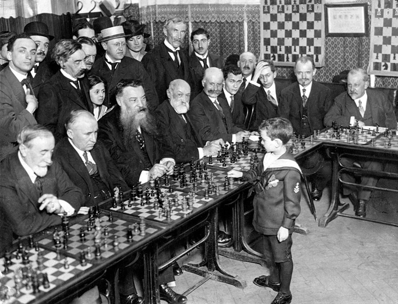 Samuel Reshevsky, age 8, defeating several chess masters at once in France, 1920